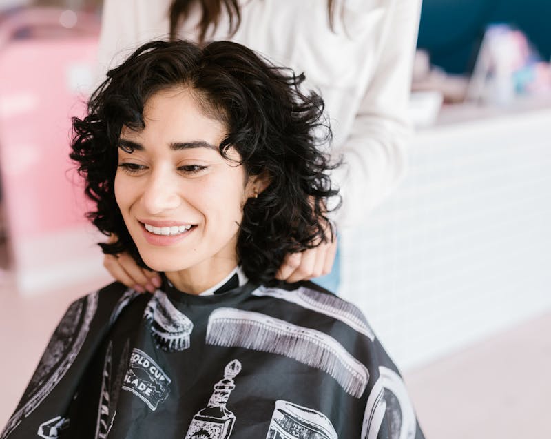 a woman getting a haircut